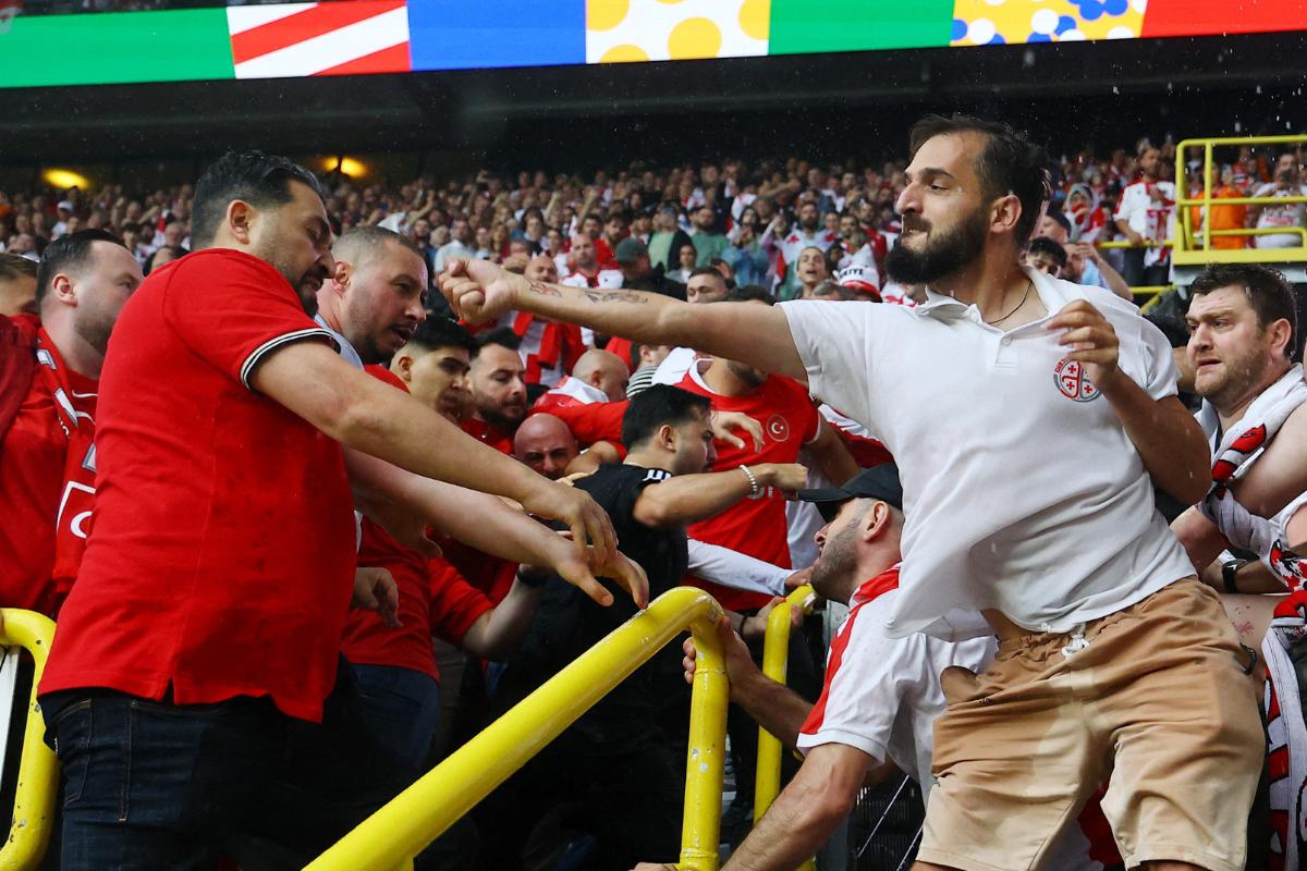 Turkey and Georgia fans clash in the stands before their Euro 2024 Group F match at Dortmund BVB Stadion, Dortmund, Germany, on Tuesday