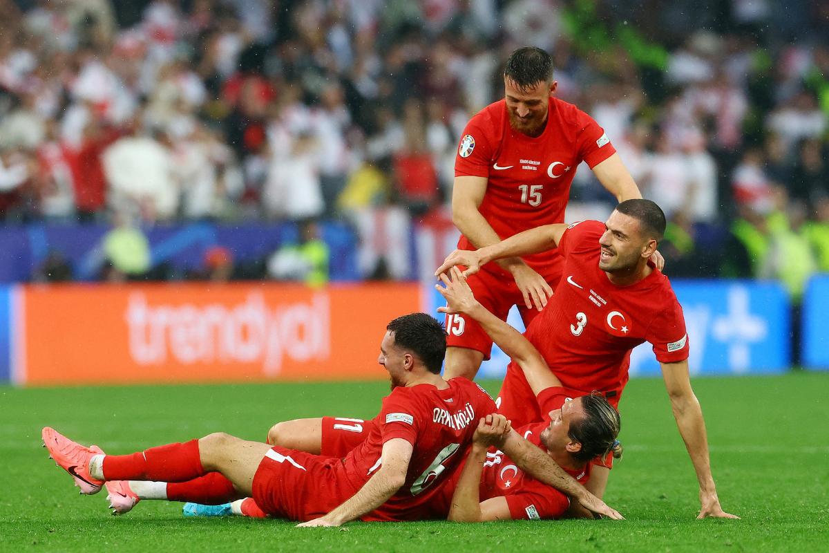 Turkey's Merih Demiral, Salih Ozcan, Yusuf Yazici and Orkun Kokcu celebrate after the match 