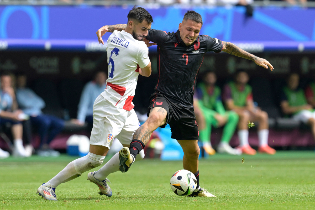 Croatia's Josip Sutalo and Albania's Rey Manaj vie for possession 