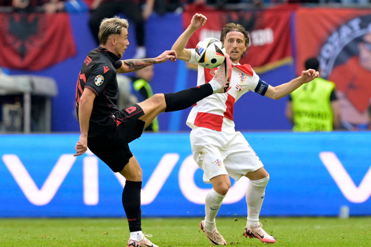Albania's Taulant Seferi in action with Croatia's Luka Modric 