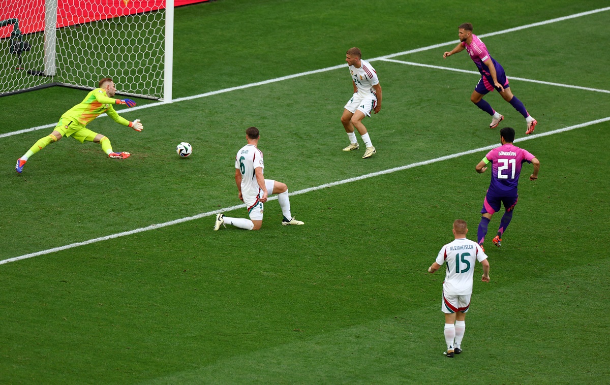 Ilkay Gundogan scores Germany's second goal past Hungary goalkeeper Peter Gulacsi in the Euro 2024 Group A match at Stuttgart Arena, Stuttgart, Germany, on Wednesday.