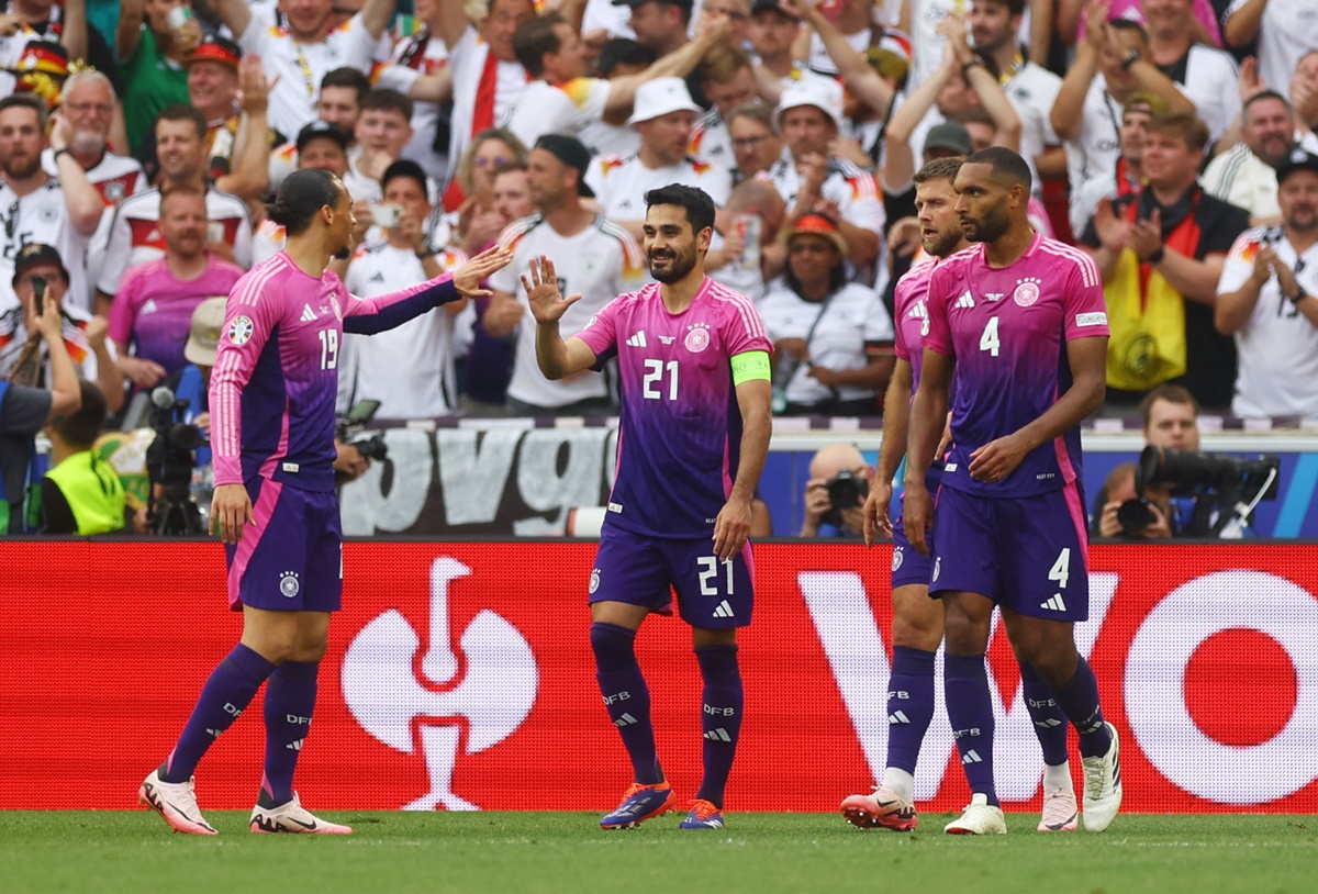 Ilkay Gundogan celebrates scoring Germany's second goal with Leroy Sane.