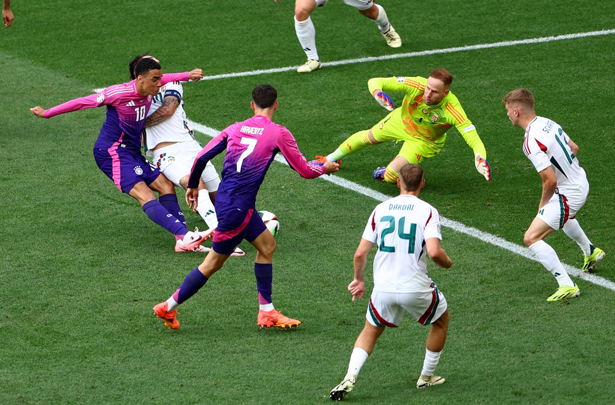 Jamal Musiala sends the ball past Hungary's goalkeeper Peter Gulacsi and a host of defenders for Germany's first goal.