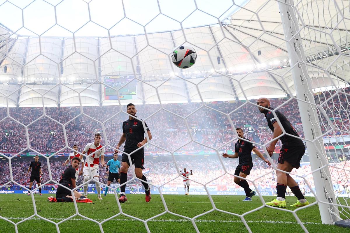  Albania's Klaus Gjasula scores an own goal to gift Croatia the lead with a second goal 