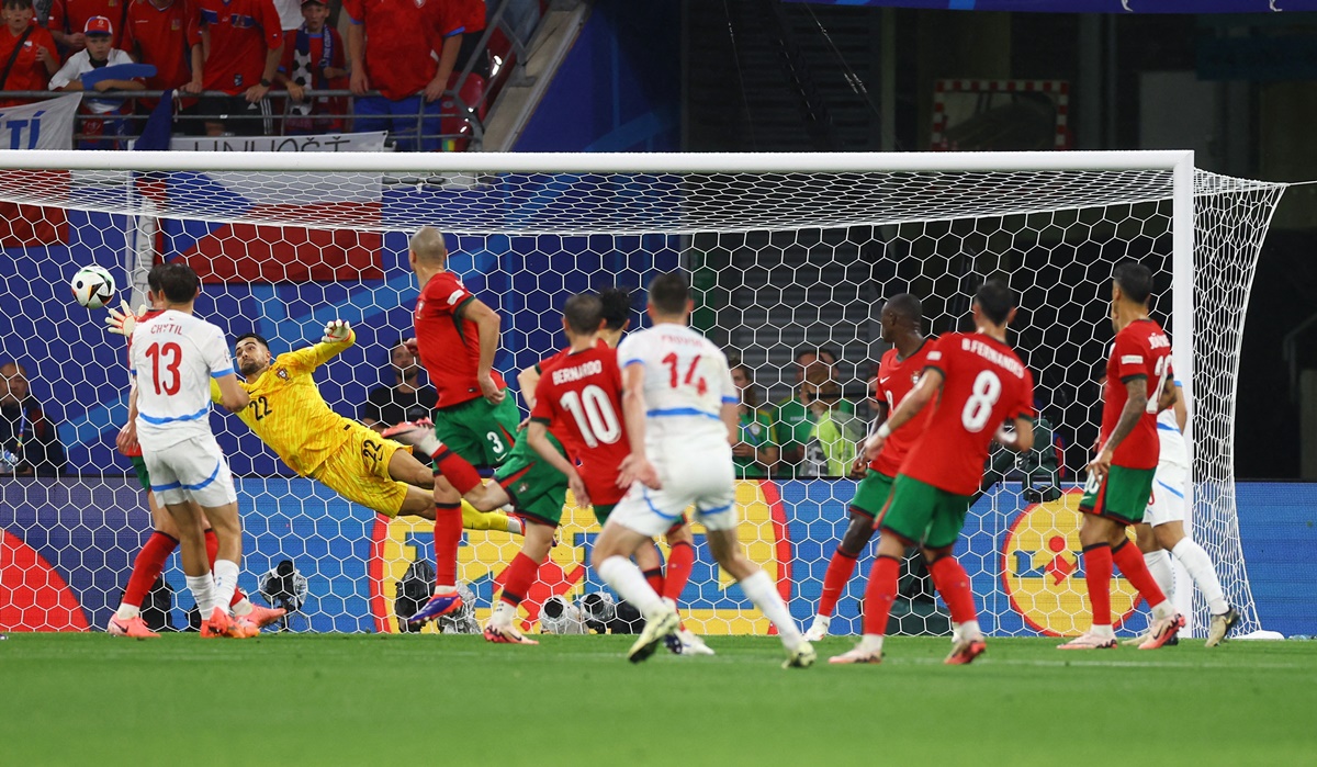 Lukas Provod (No. 14) sends the ball curling into the Portugal goal to put the Czech Republic ahead. 