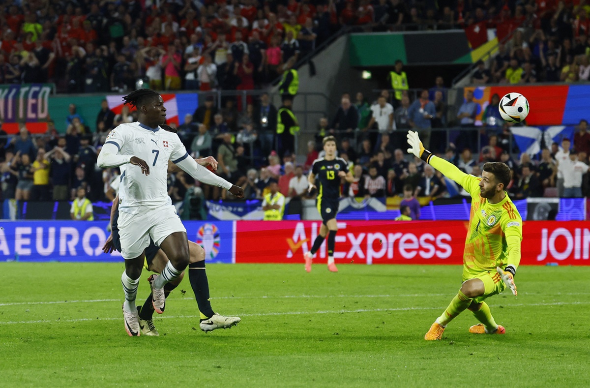 Switzerland's Breel Embolo sends the ball past Scotland goalkeeper Angus Gunn but the goal was disallowed.