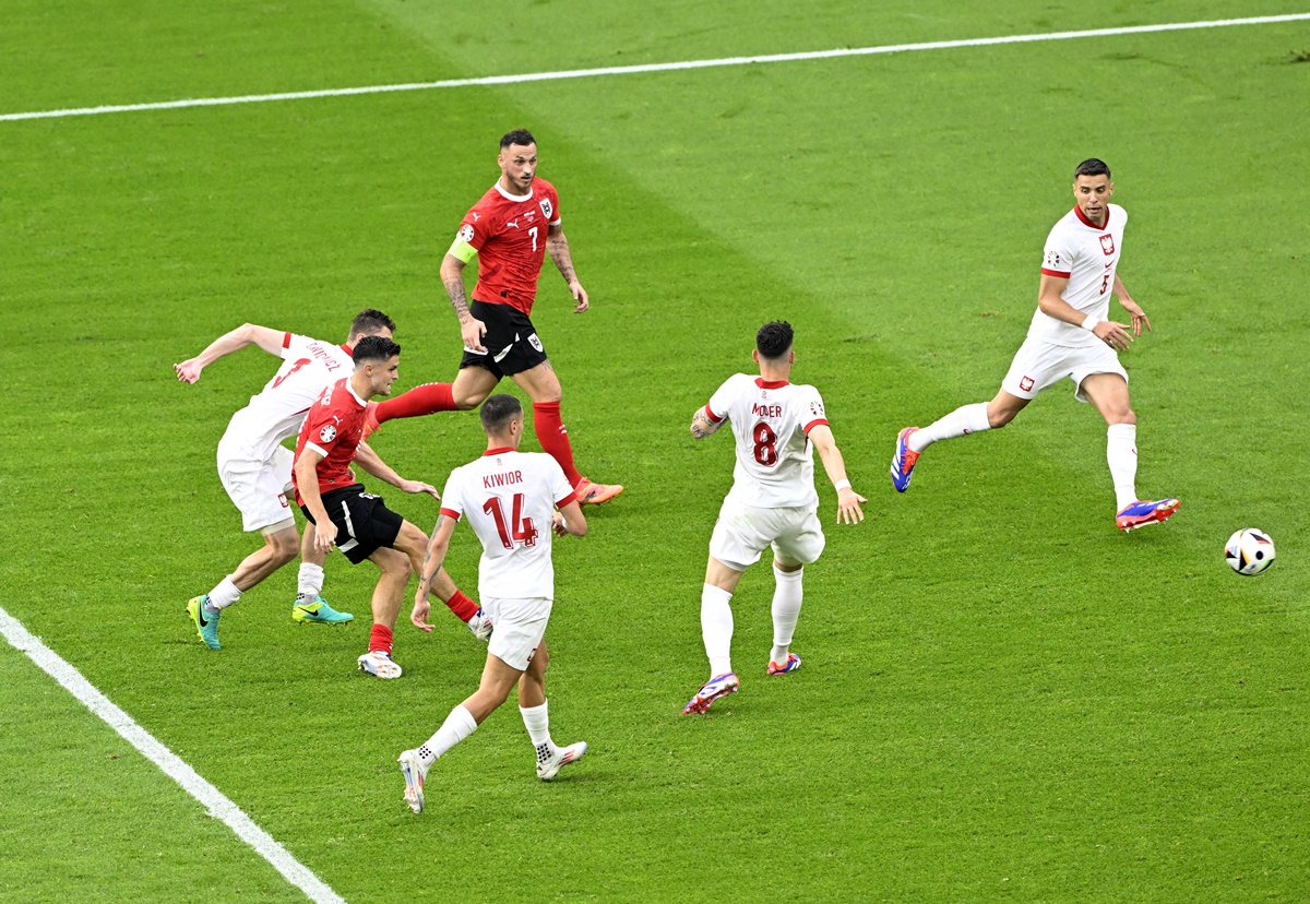 Christoph Baumgartner (centre) scores Austria's second goal.