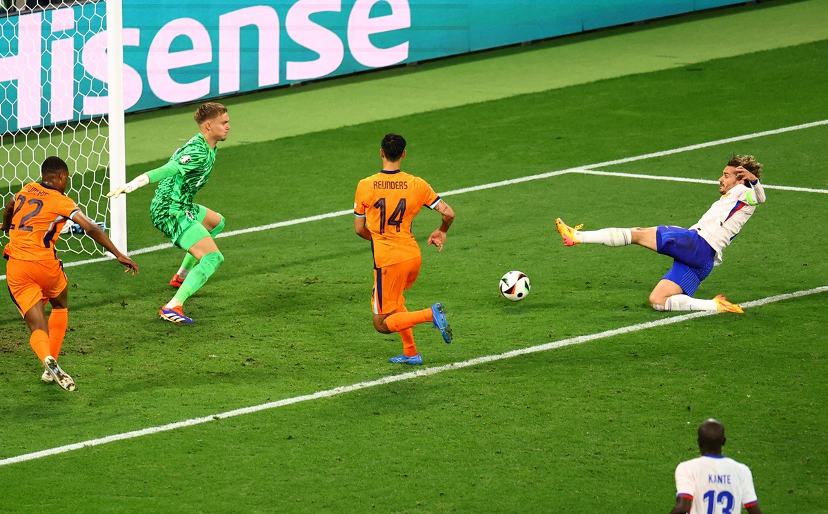  France's Antoine Griezmann misses a chance to score when ideally placed.