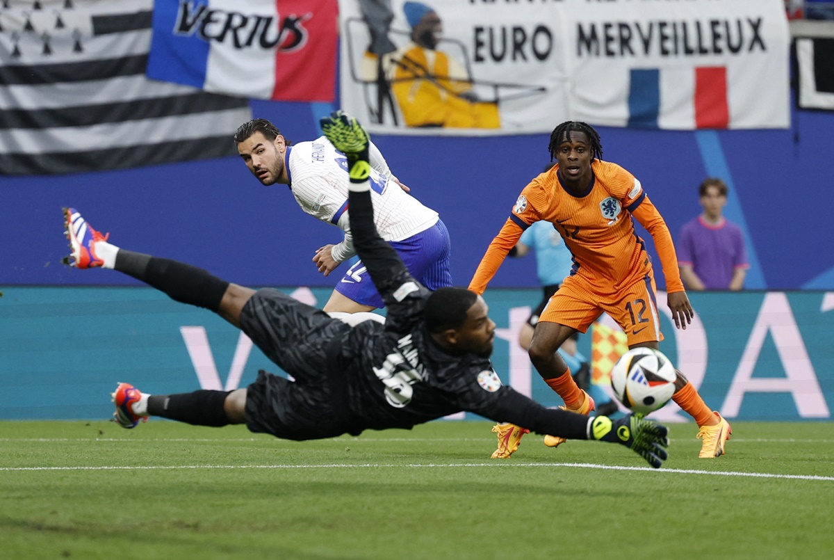 The Netherlands striker Jeremie Frimpong watches as his shot is saved by France goalkeeper Mike Maignan during the Euro 2024 Group D match at Leipzig Stadium, Germany, on Friday.