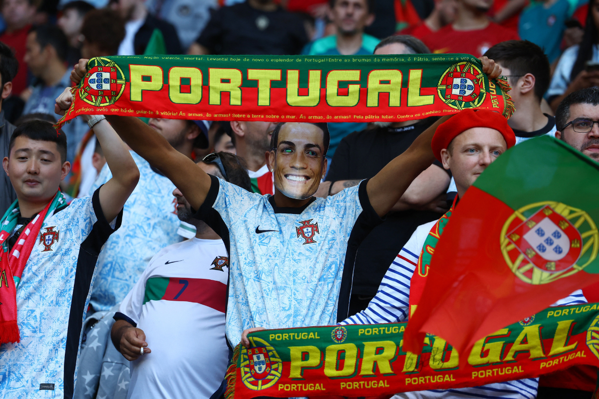 Portugal fan in a Cristiano Ronaldo mask celebrates after the match against Turkey at Dortmund BVB Stadion, Dortmund, Germany, on Saturday.