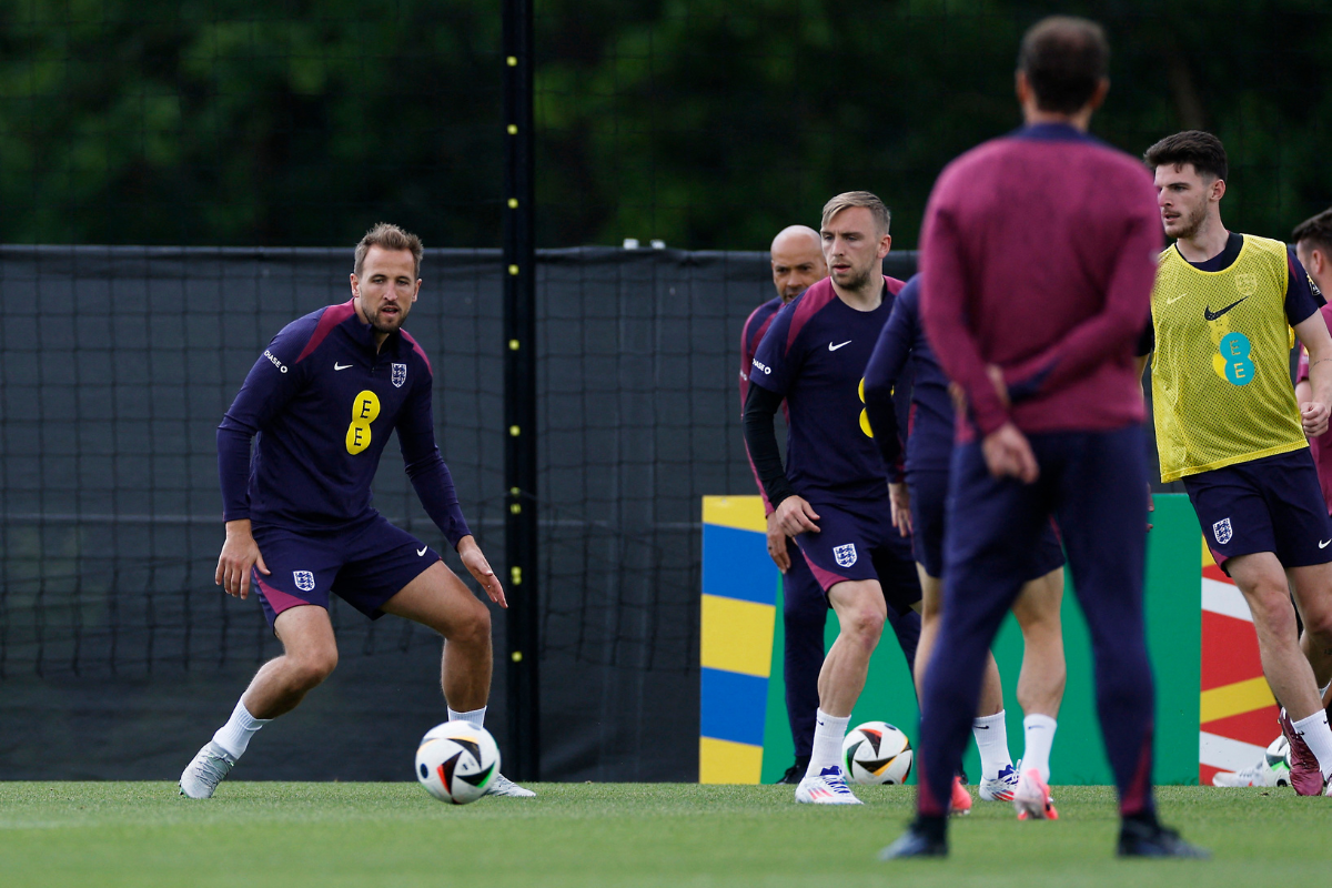England's Harry Kane and teammates go through the grind as manager Gareth Southgate looks on during training