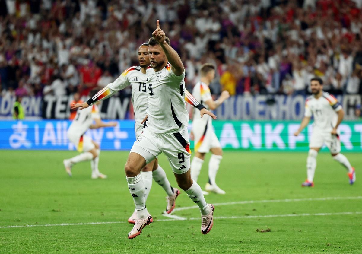 Niclas Fullkrug celebrates scoring.