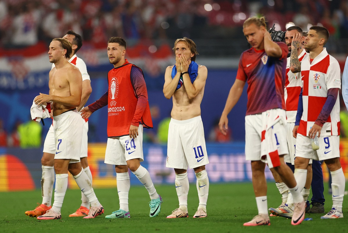 Croatia's Lovro Majer, Marco Pasalic, Luka Modric and Andrej Kramaric wear a dejected look after the match.