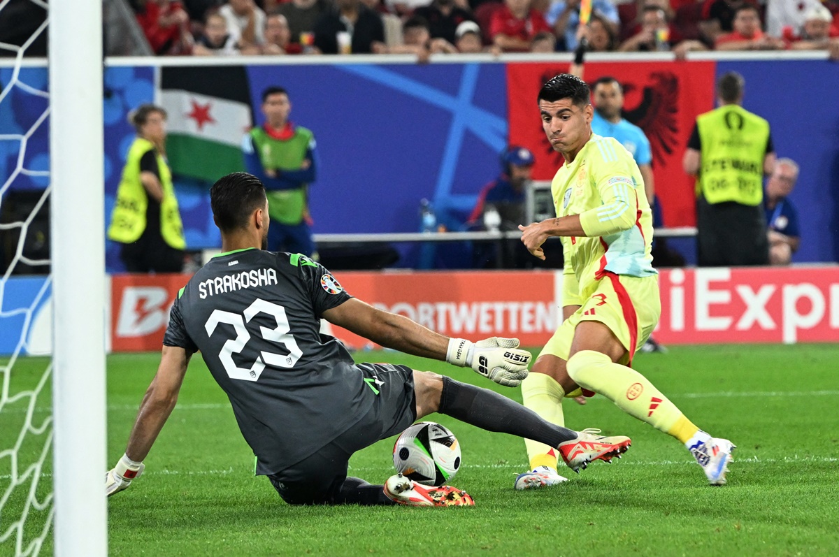 Albania's goalkeeper Thomas Strakosha makes a save off Spain's Alvaro Morata.