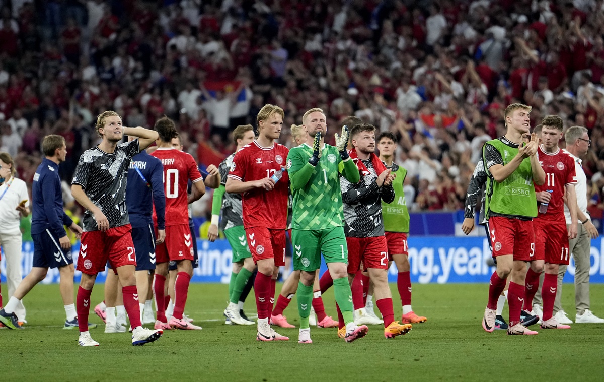 Denmark's goalkeeper Kasper Schmeichel and teammates applaud fans after the match.