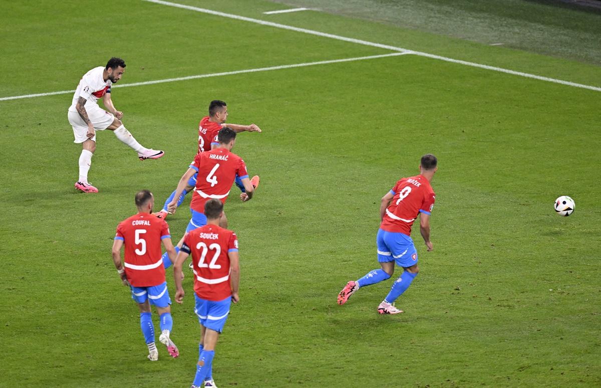 Hakan Calhanoglu scores Turkey's first goal.