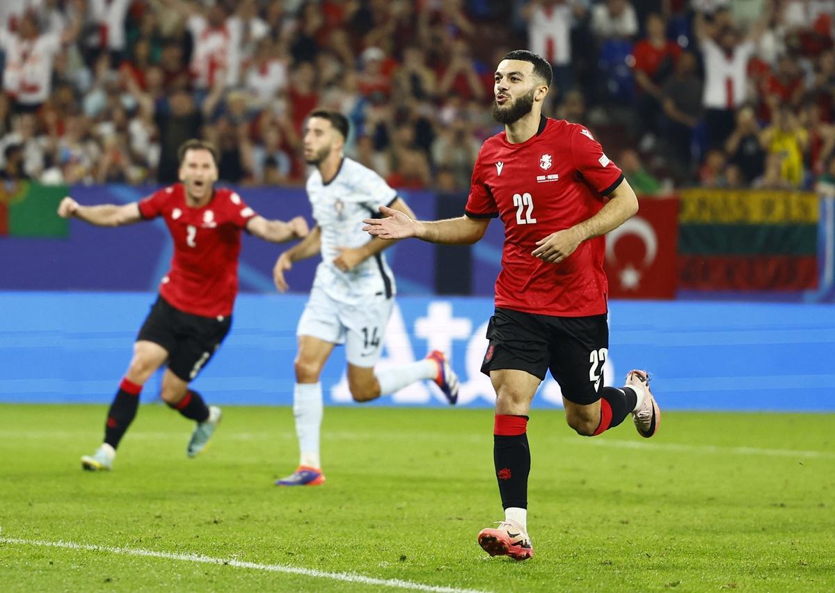 Georges Mikautadze celebrates scoring Georgia's second goal from the penalty spot.