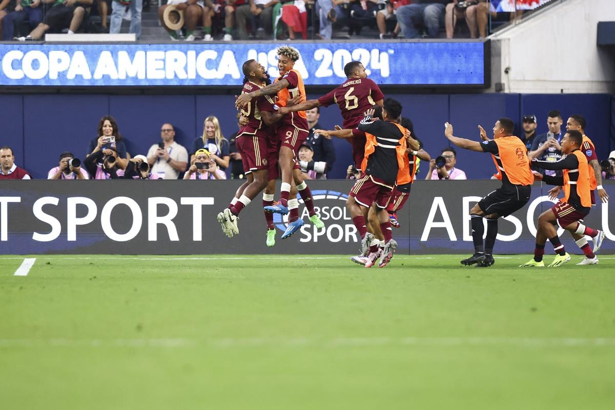 Venezuela striker José Salomón Rondón (No. 23) celebrates with teammates after scoring a penalty against Mexico in the Copa America quarter-finals at SoFi Stadium. 