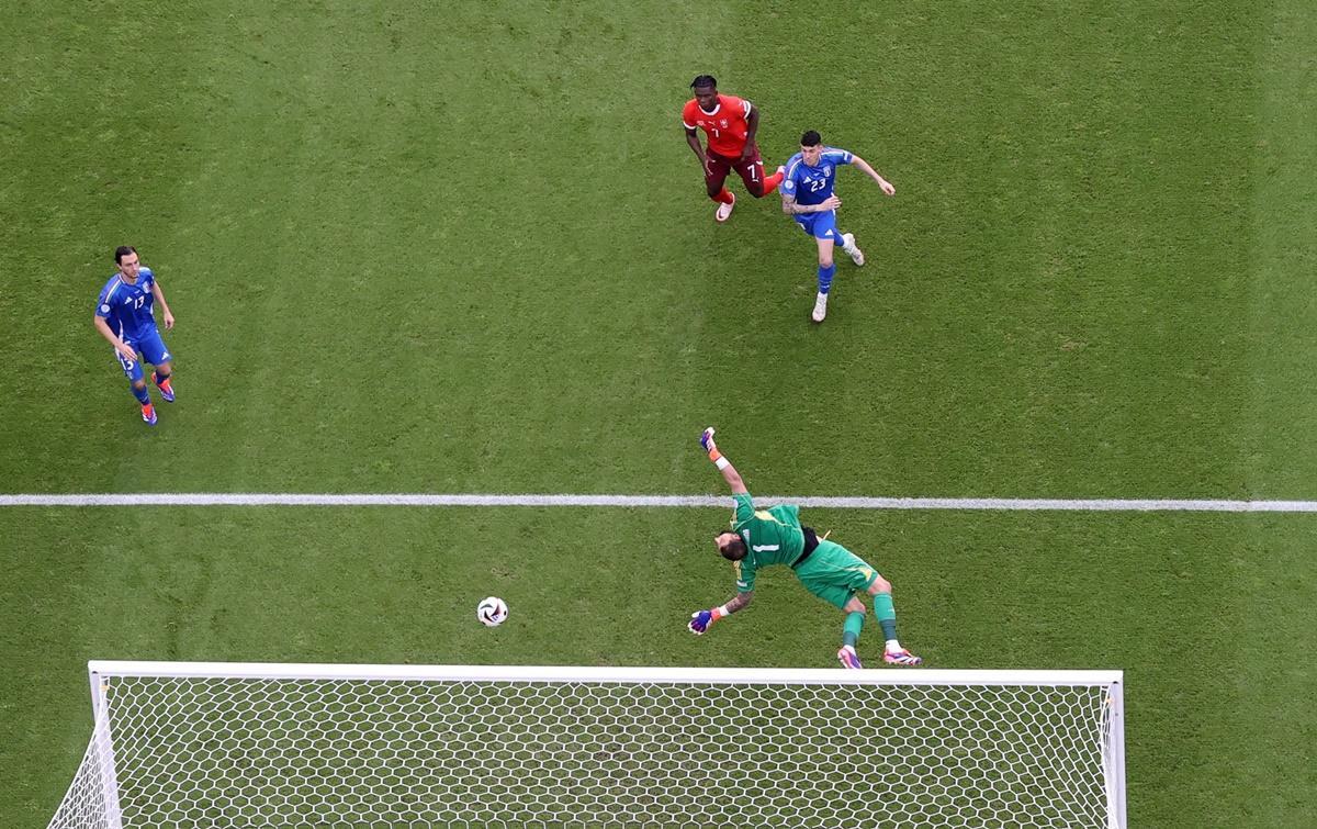 Ruben Vargas sends the ball flying past Italy's Gianluigi Donnarumma for Switzerland's second goal in the Euro 2024 Round of 16 match at Berlin Olympiastadion, Berlin, Germany, on Saturday.