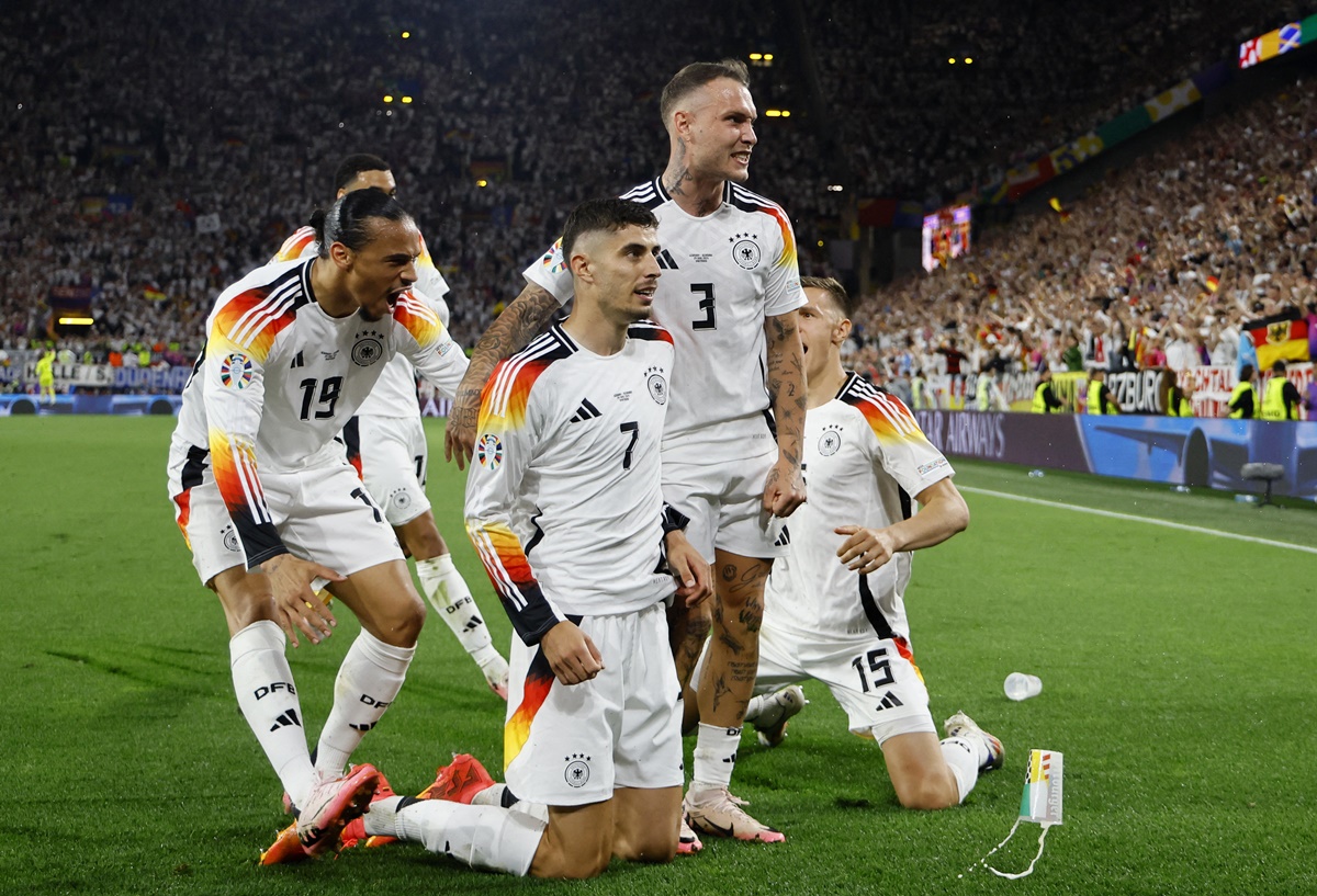 Kai Havertz celebrates with teammates after putting Germany ahead in the match from the penalty spot.