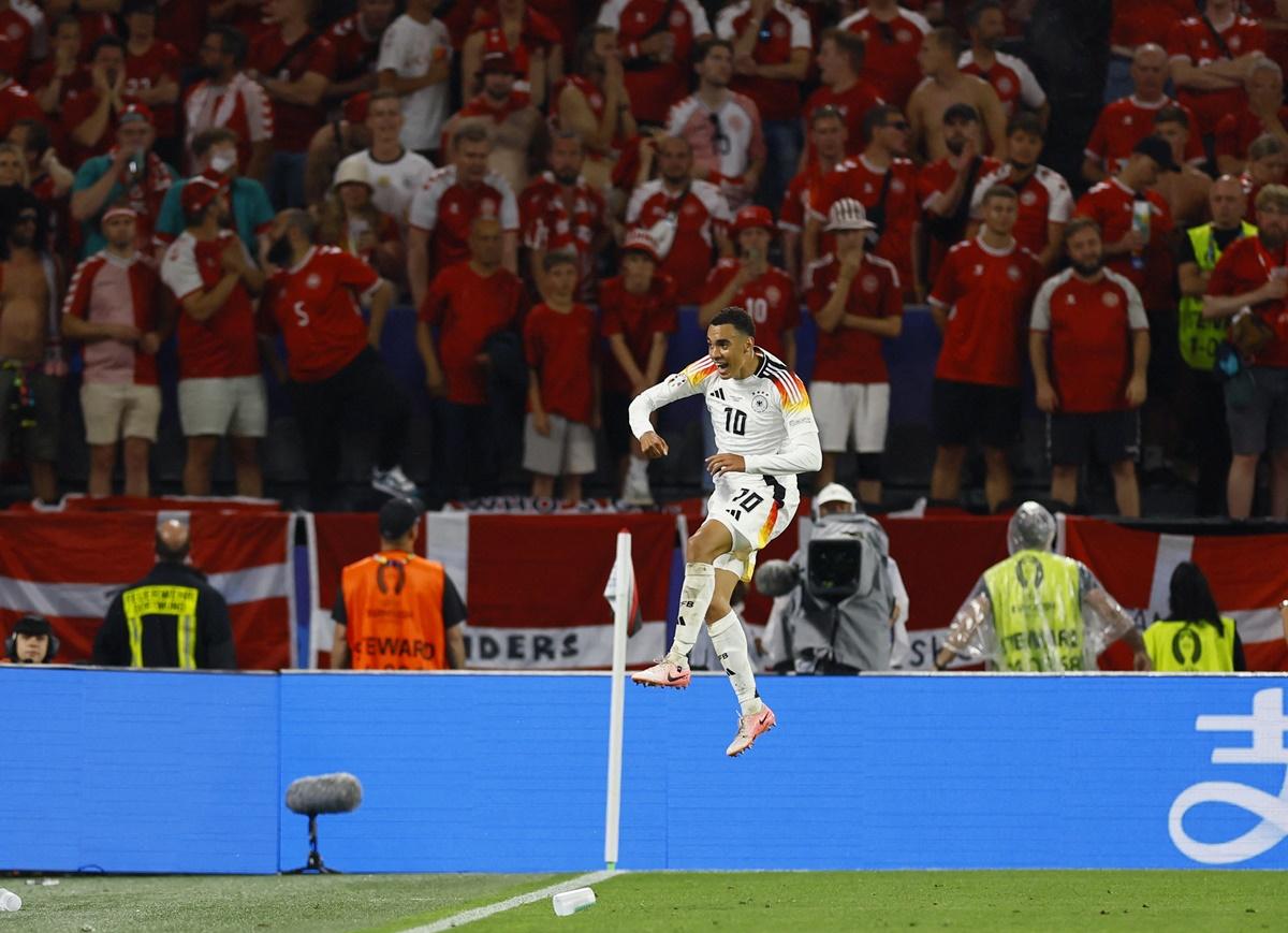 Jamal Musiala celebrates scoring Germany's second goal.