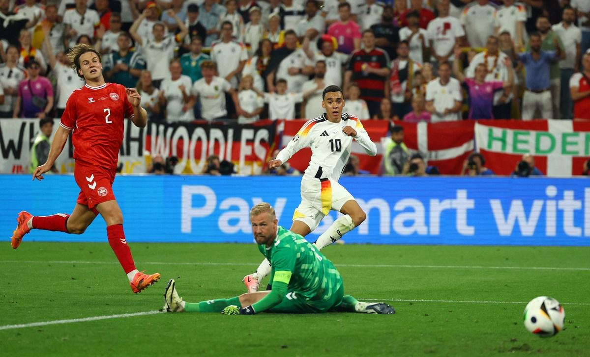 Jamal Musiala sends the ball past Denmark goalkeeper Kasper Schmeichel for Germany's second goal in the Euro 2024 Round of 16 match at Dortmund BVB Stadion, Dortmund, Germany, on Saturday.