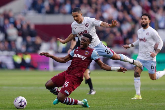 Aston Villa's Youri Tielemans in action with West Ham United's Mohammed Kudus during  the Premier League match at London Stadium, London, on Sunday