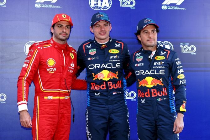 Red Bull's Max Verstappen, after qualifying in pole position for the Australian Grand Prix, with second-placed Ferrari's Carlos Sainz Jr. and third-placed Red Bull's Sergio Perez