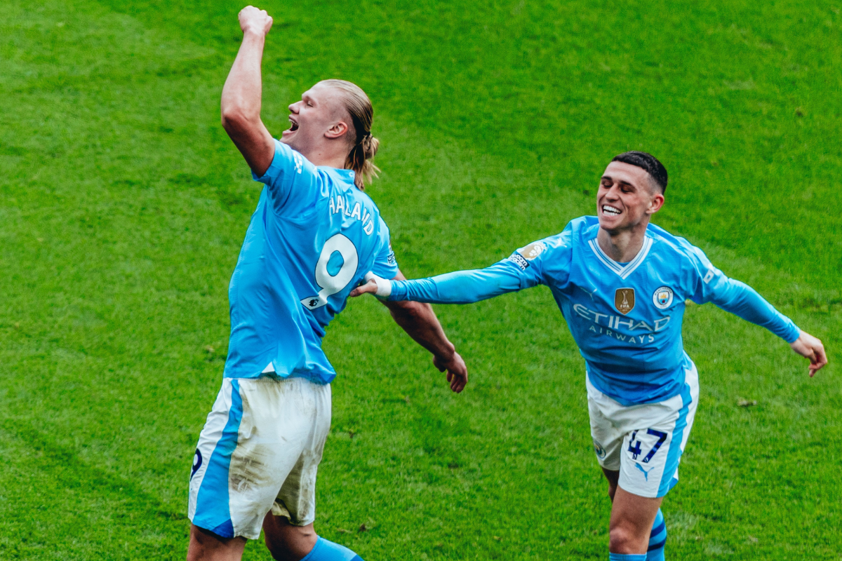 Manchester City's Erling Haaland celebrates with Phil Foden after scoring against Wolverhampton Wanderers at the Etihad Stadium in Manchester