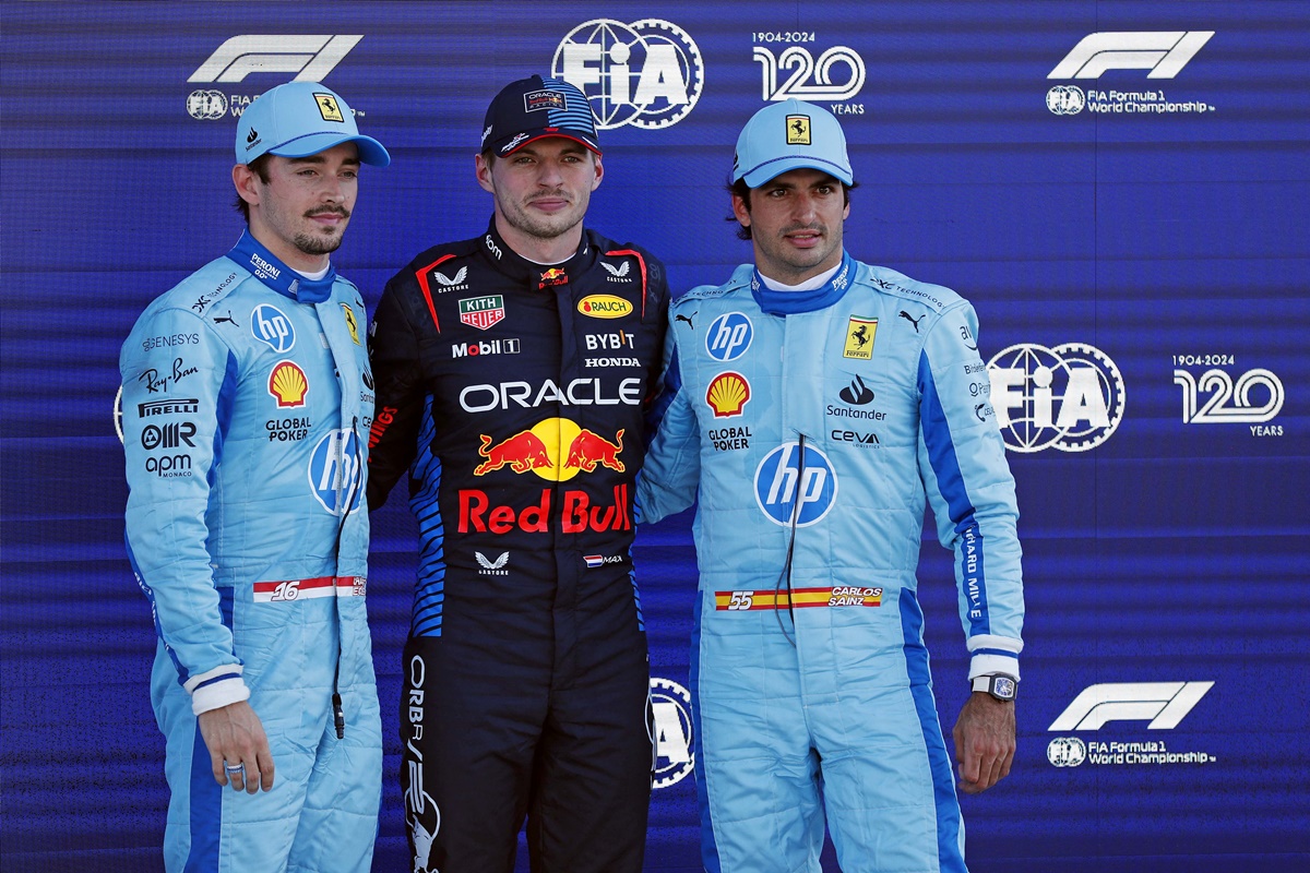 Ferrari driver Charles Leclerc, Red Bull Racing's Max Verstappen and Ferrari's Carlos Sainz pose for a picture after F1 qualifying for Miami Grand Prix at Miami International Autodrome on Saturday. 