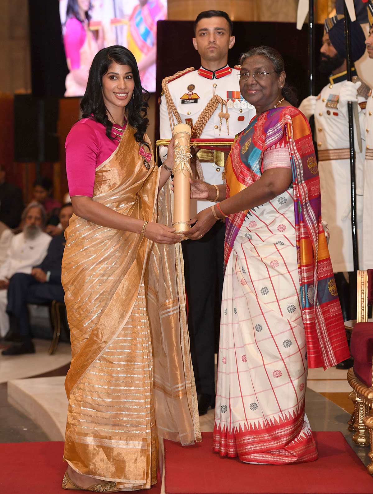Indian squash star Joshna Chinappa receives the Padma Shri from President Draupadi Murmu at the Rashtrapati Bhawan in New Delhi on Thursday