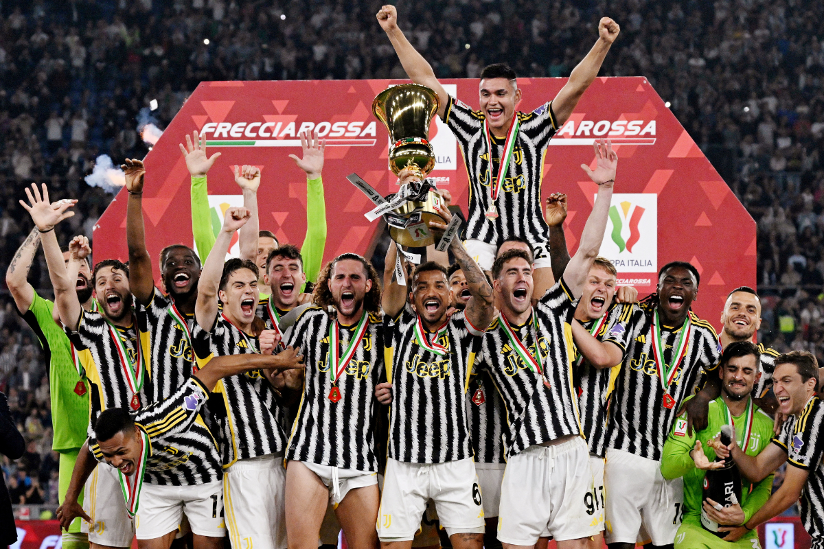 Juventus' Danilo celebrates with the trophy and teammates after winning the Coppa Italia final, beating Atalanta, at the Stadio Olimpico, Rome, Italy