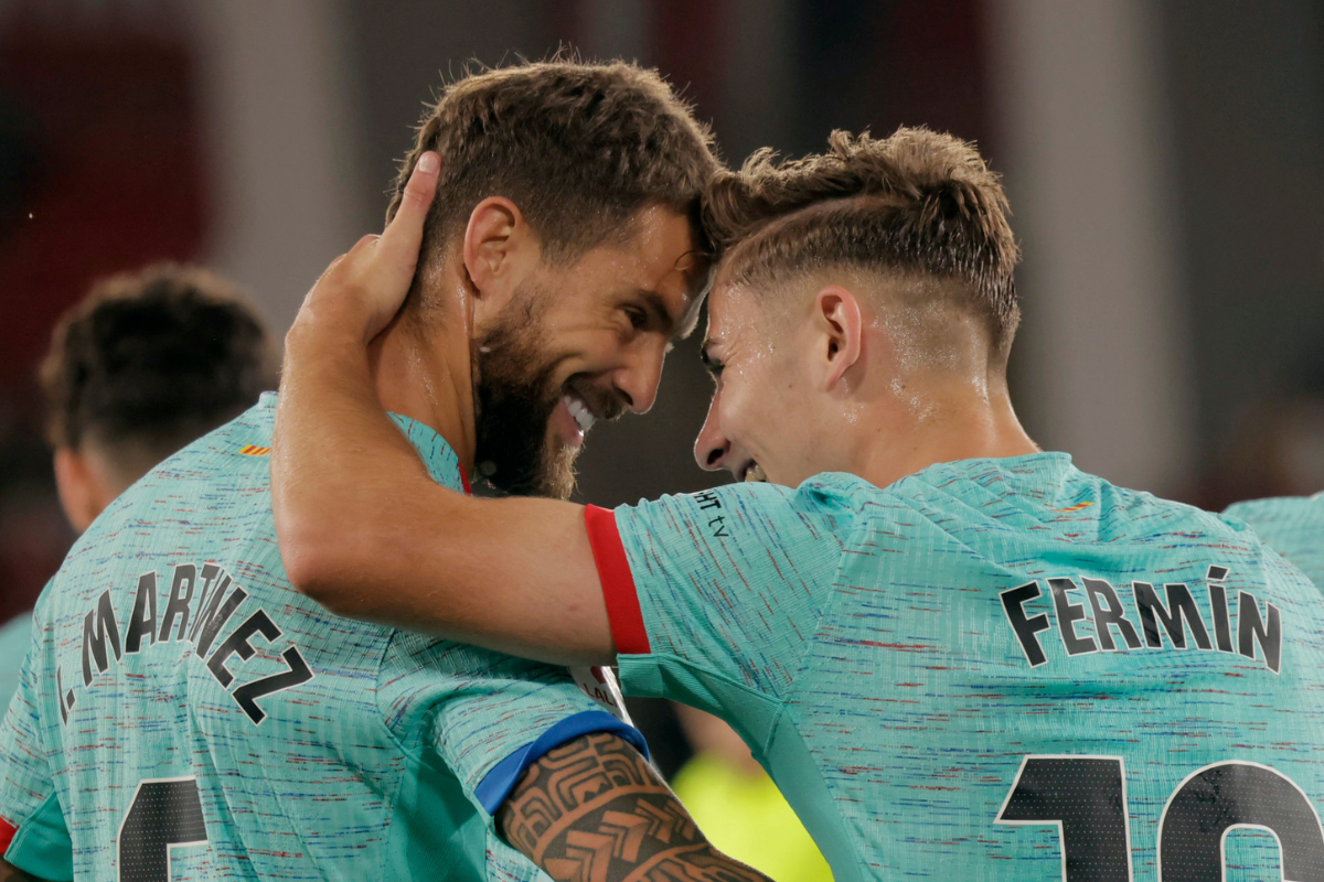 FC Barcelona's Fermin Lopez celebrates with Inigo Martinez after scoring their first goal against Almeria during their La Liga match at Estadio de los Juegos Mediterraneos, Almeria, on Thursday 