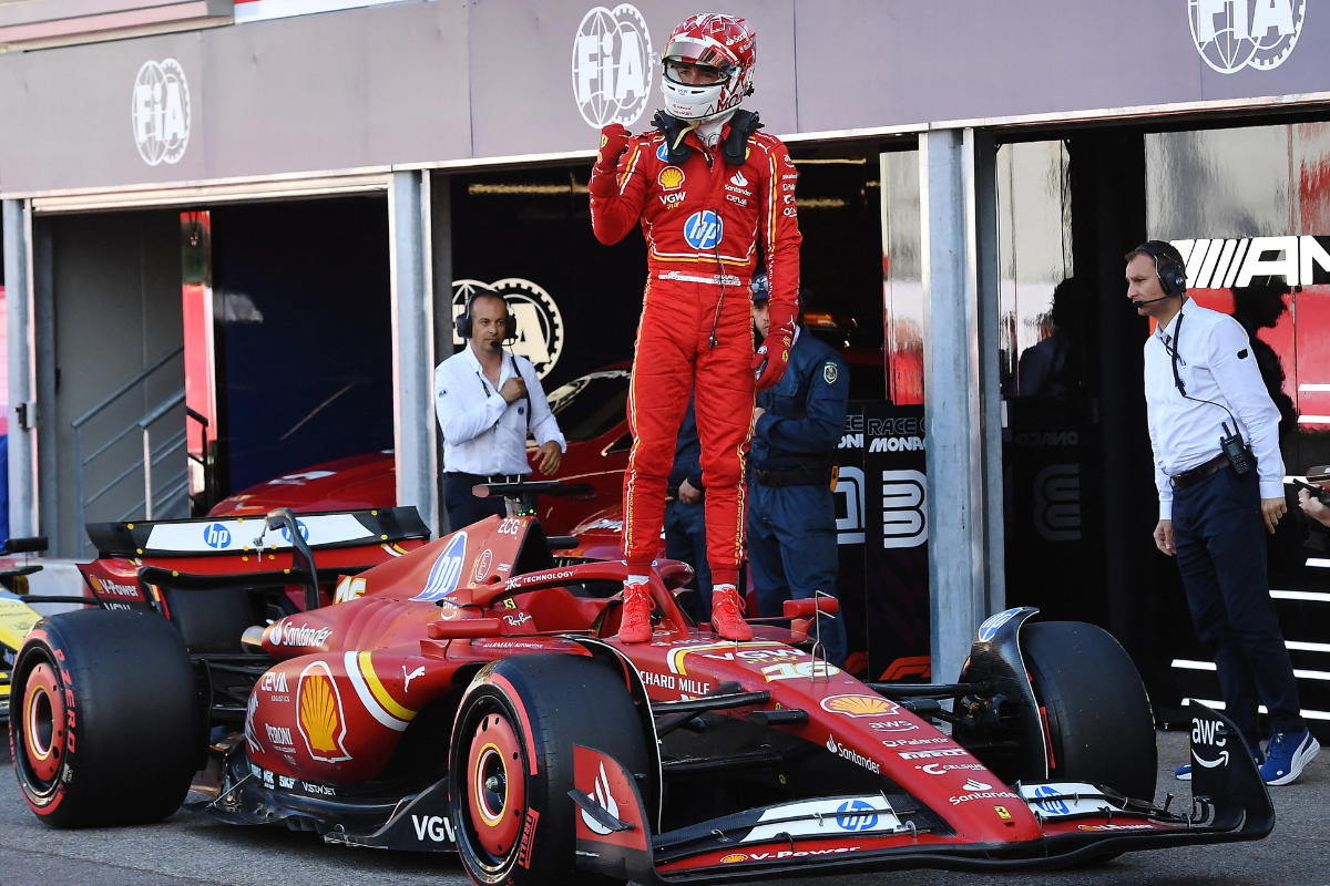 Ferrari's Charles Leclerc celebrates after qualifying in pole position 