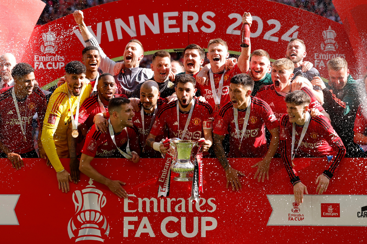 Manchester United's Bruno Fernandes and teammates  celebrates with the trophy after winning the FA Cup