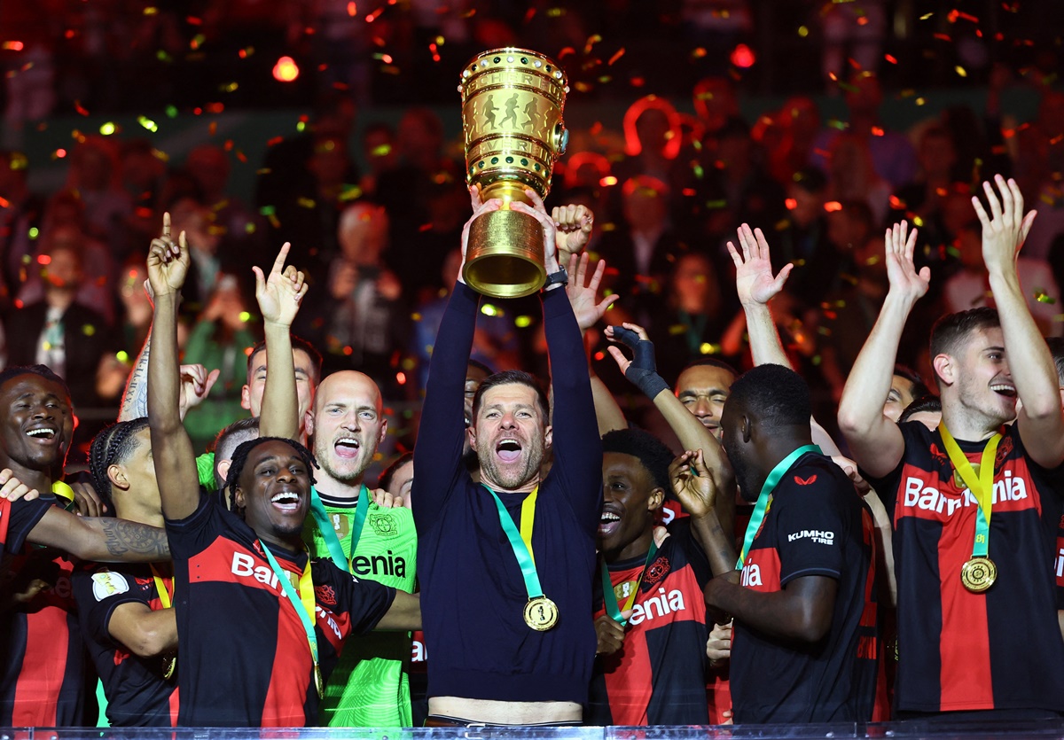Bayer Leverkusen coach Xabi Alonso celebrates with the trophy after winning the DFB Cup at Olympiastadion, Berlin, on Saturday.