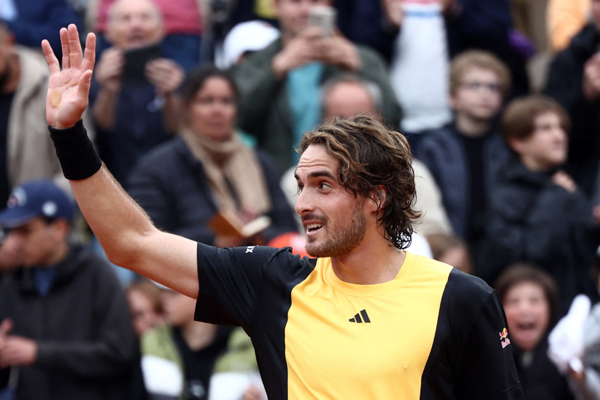 Greece's Stefanos Tsitsipas celebrates after winning his second round match against Germany's Daniel Altmaier at the French Open in Paris on Thursday