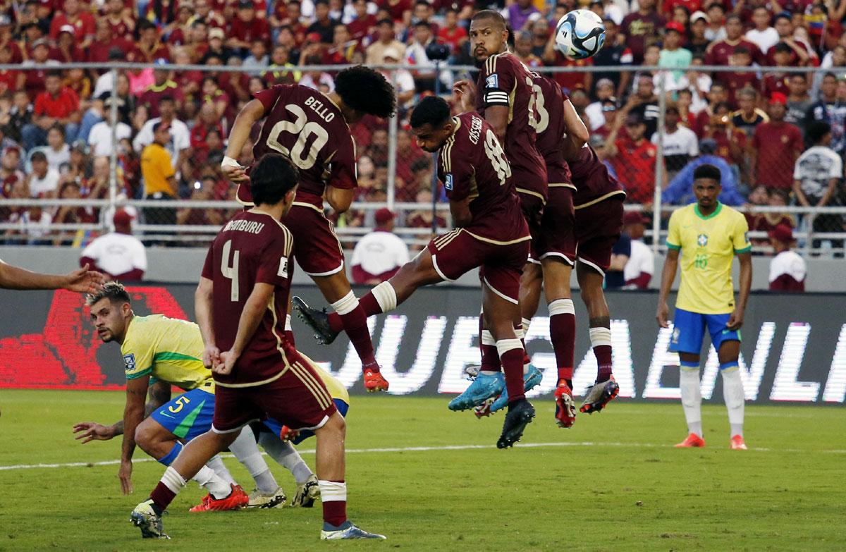 Venezuela's players try to head the ball