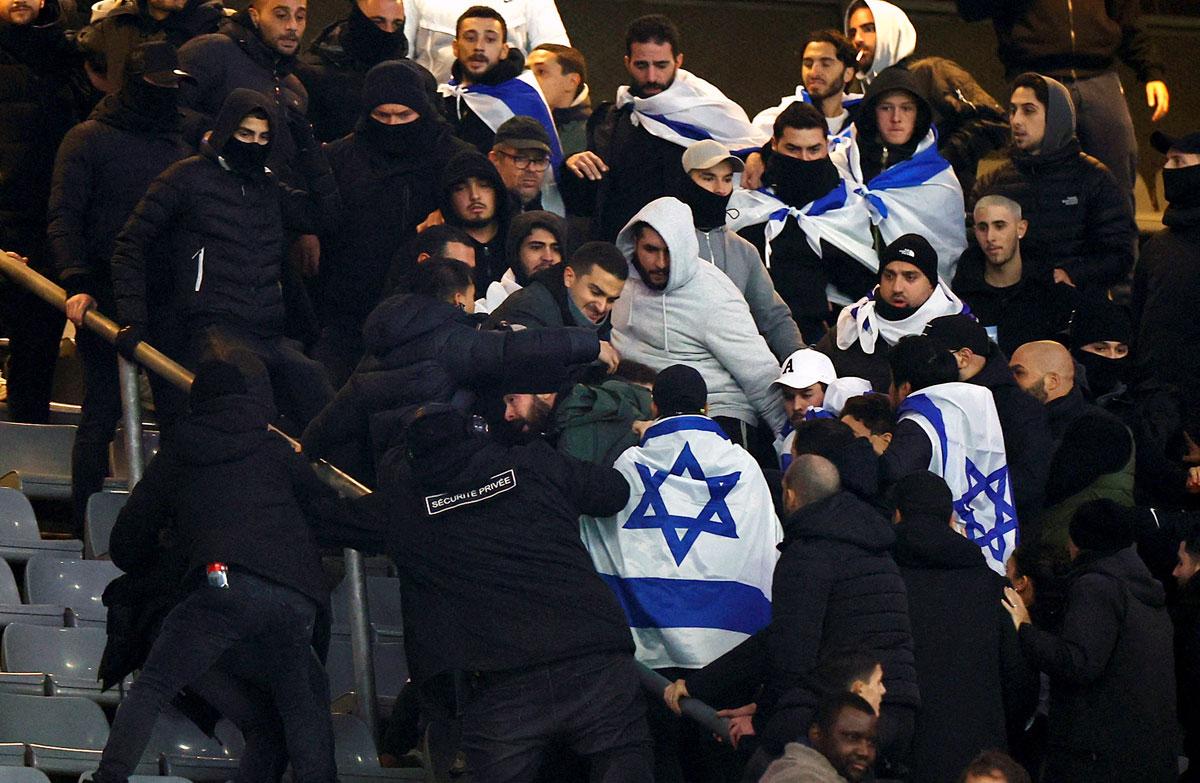 Israel fans clash with security staff during the match