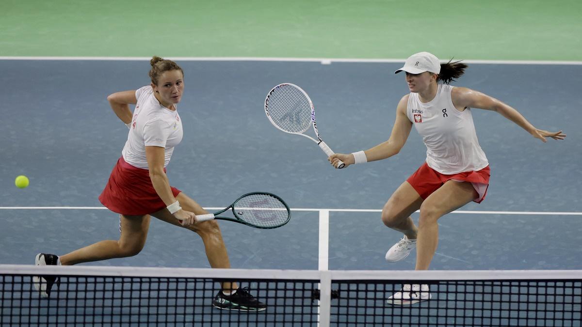 Poland's Iga Swiatek and Katarzyna Kawa in action during the Billie Jean King Cup Finals doubles match against the Czech Republic's Marie Bouzkova and Katerina Siniakova, at Palacio de Deportes Jose Maria Martin Carpena Arena, Malaga, Spain.