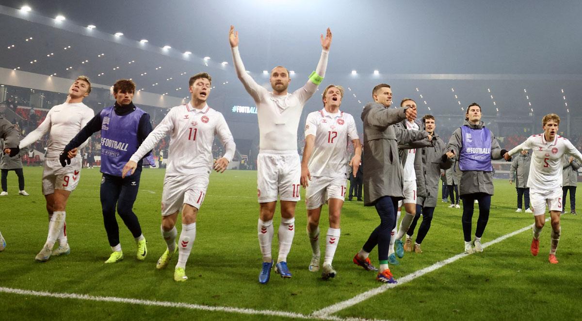 Denmark's Christian Eriksen celebrates with teammates