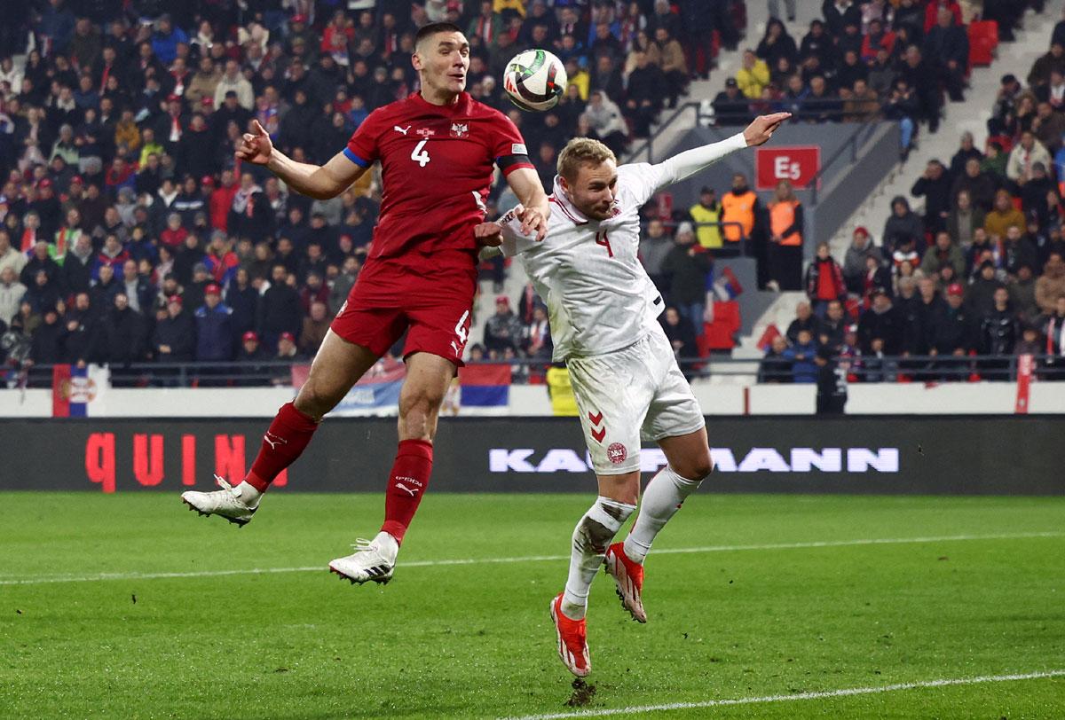 Serbia's Nikola Milenkovic in action with Denmark's Victor Nelsson