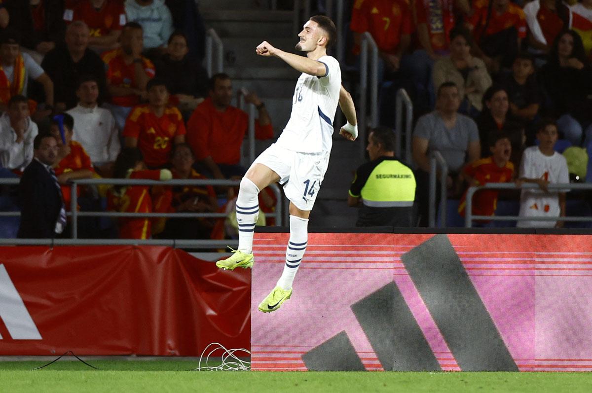 Switzerland's Andi Zeqiri celebrates