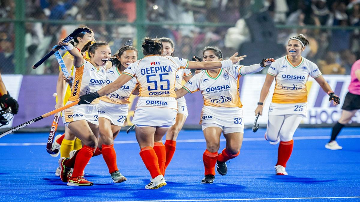 India's players celebrate with Deepika after she scores following a penalty-corner  