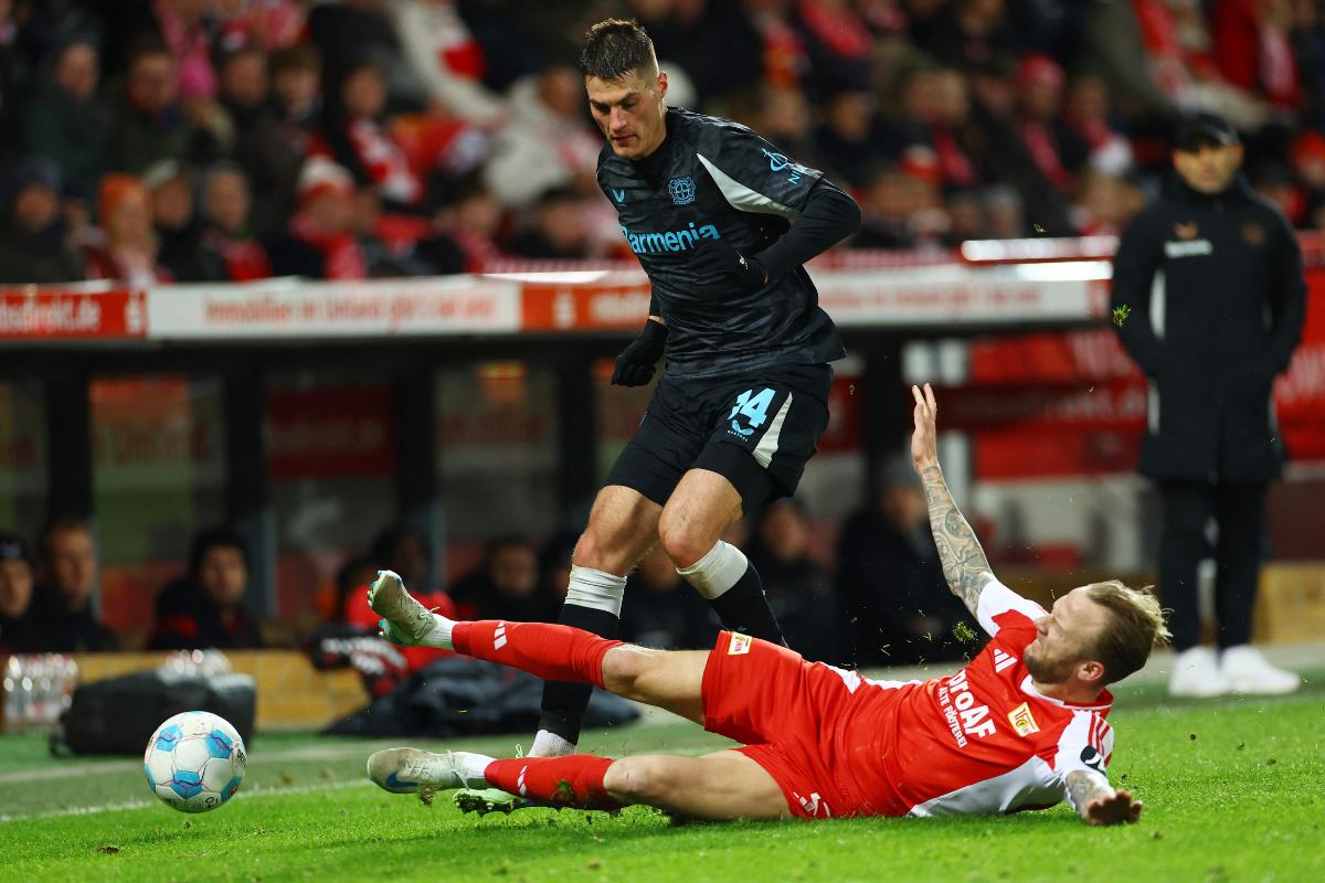 Bayer Leverkusen's Patrik Schick in action with 1. FC Union Berlin's Kevin Vogt during their Bundesliga match at  Stadion An der Alten Forsterei, Berlin, Germany, on Saturday 