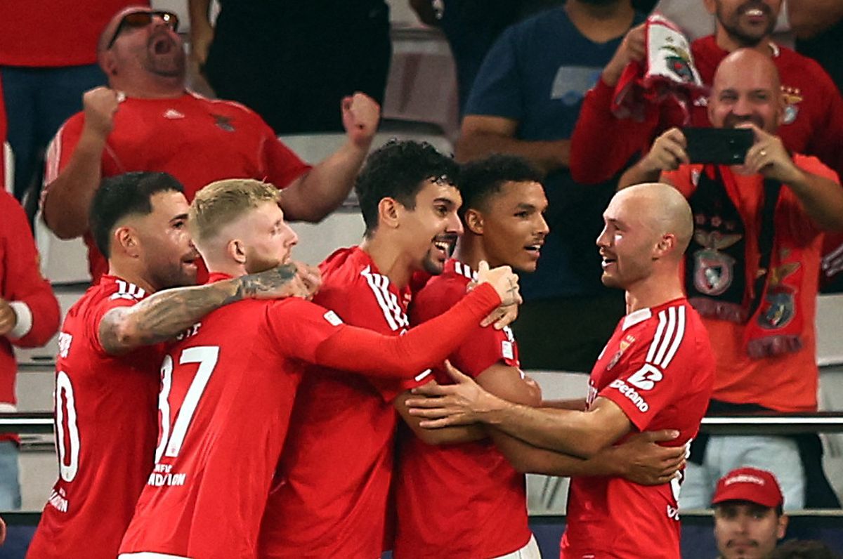 Benfica's players celebrate after Alexander Bah scored the third goal against Atletico Madrid