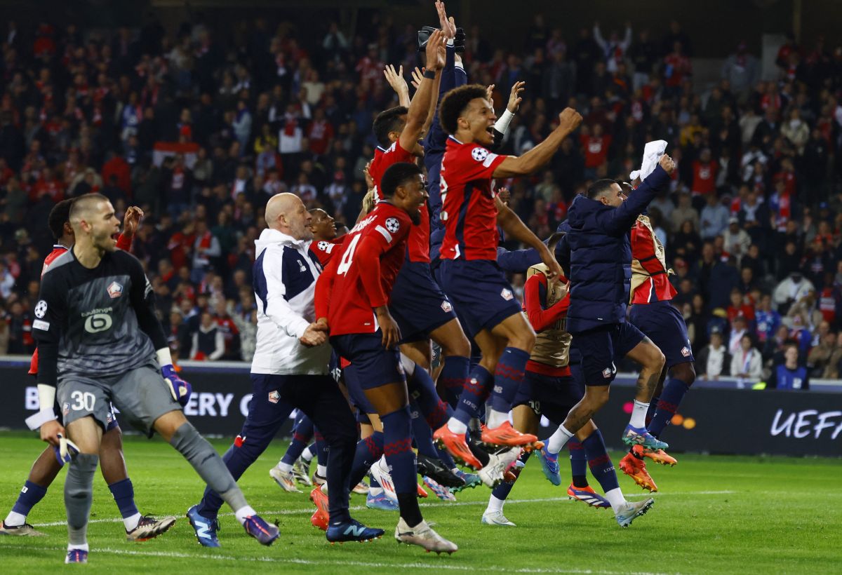 Lille's players celebrate winning their match against Real Madrid