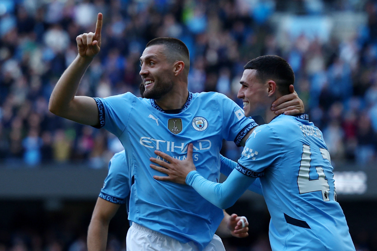 Manchester City's Mateo Kovacic celebrates with teammate Phil Foden on scoring against Fulham 