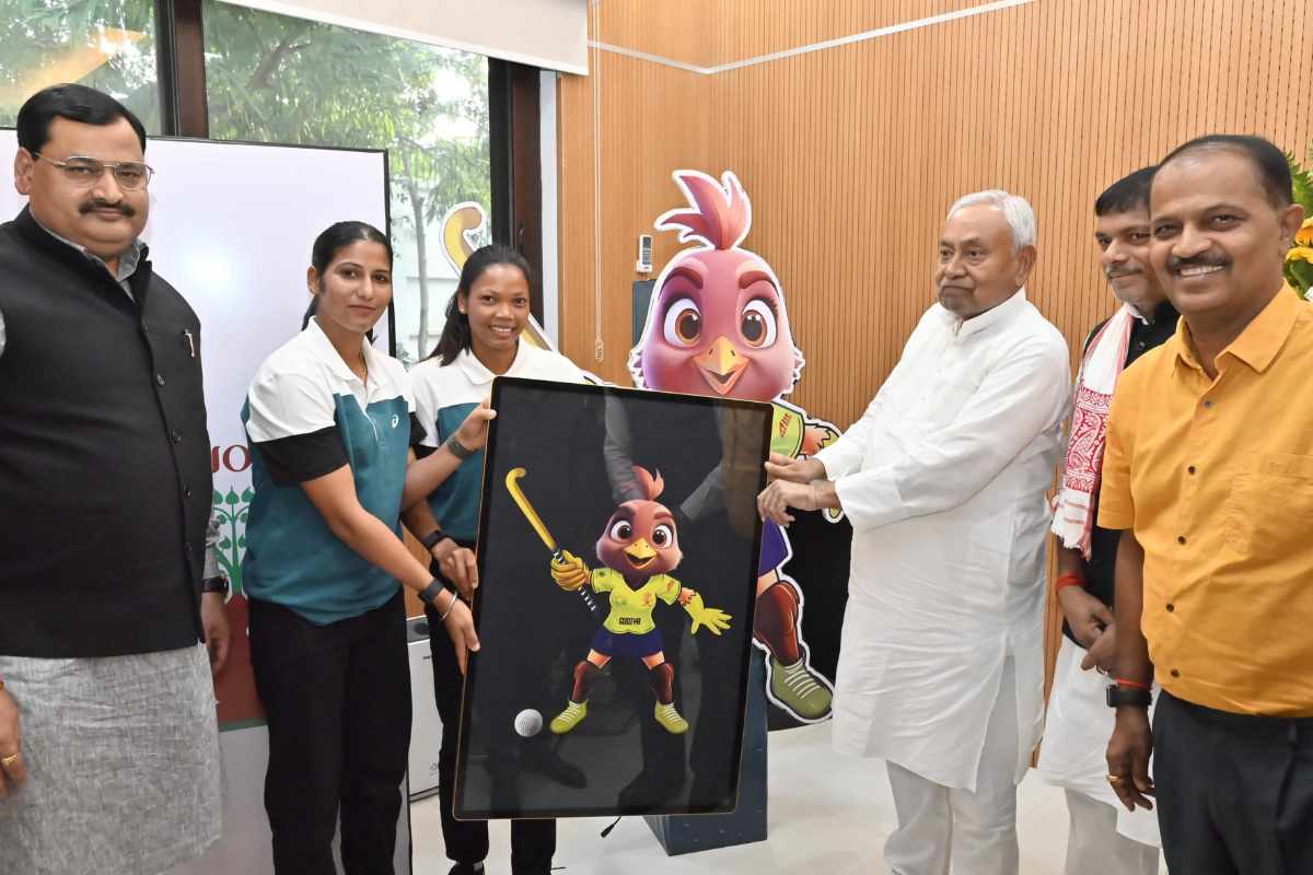 Bihar Chief Minister Nitish Kumar unveils the logo for the Women's Asian Champions Trophy mascot alongside Indian women's team captain Selema Tete and vice-captain Navneet Kau