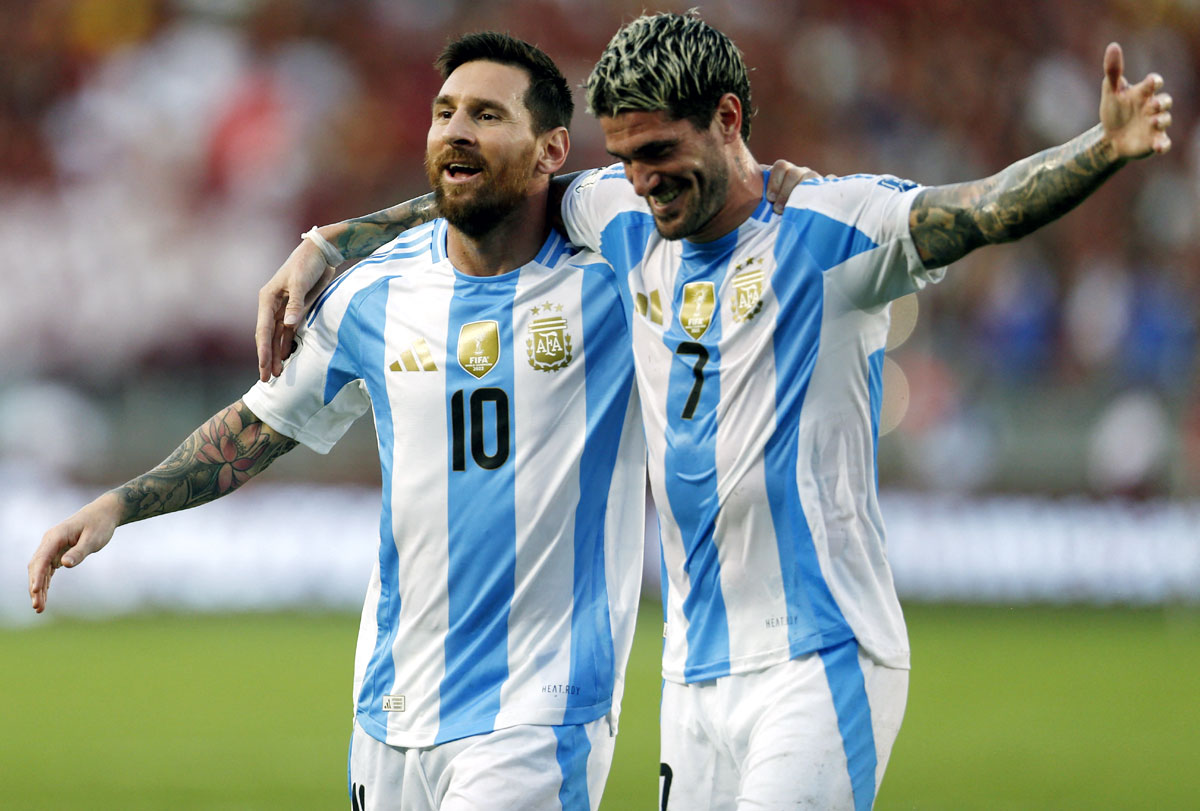 Argentina's Lionel Messi and Rodrigo De Paul celebrate